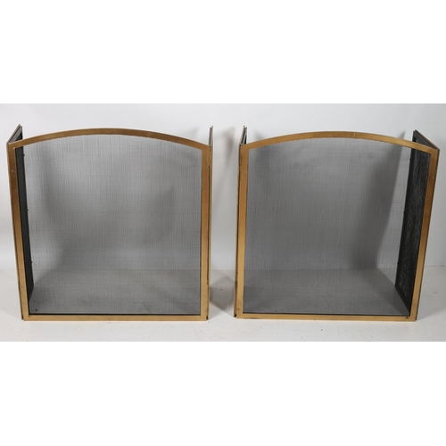 656 - A PAIR OF HEAVY BRASS AND MESH THREE FOLD FIRE SCREENS each of rectangular arched form 83cm x 130cm