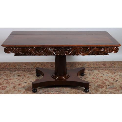 66 - A VICTORIAN MAHOGANY CROSSBANDED AND CARVED CENTRE TABLE of rectangular outline the shaped top with ... 