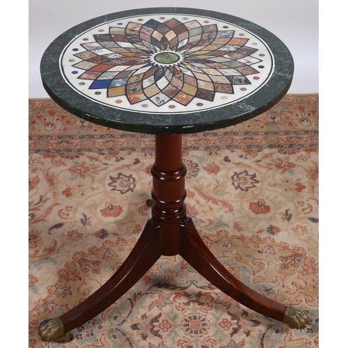 667A - A CONTINENTAL MAHOGANY SPECIMEN MARBLE TABLE of circular outline inlaid with specimen marbles and ha... 