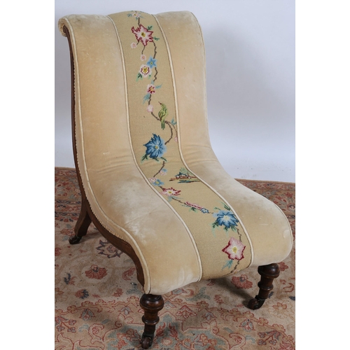 668 - A 19TH CENTURY MAHOGANY AND UPHOLSTERED NURSING CHAIR the shaped back and seat with upholstered pane... 