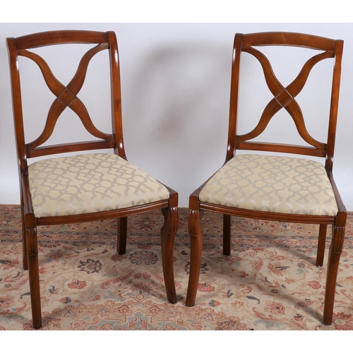 670 - A PAIR OF REGENCY DESIGN CHERRYWOOD DINING CHAIRS each with a curved top rail and X-shaped splats wi... 