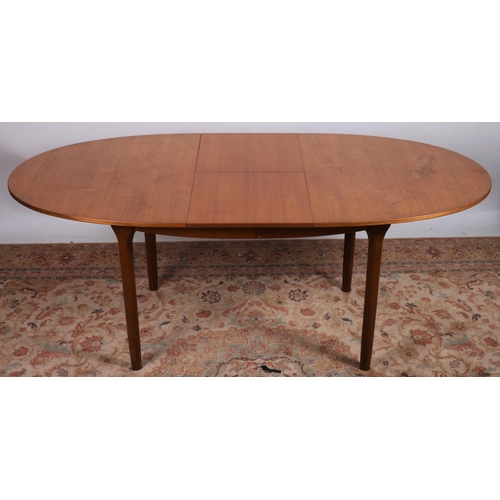 675 - A VINTAGE TEAK DINING TABLE by Mackintosh and Co. Ltd. Scotland of oval outline the shaped top with ... 