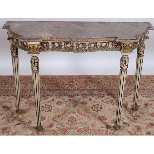 682 - A CONTINENTAL GREY PAINTED AND PARCEL GILT CONSOLE TABLE of serpentine outline surmounted by a veine... 