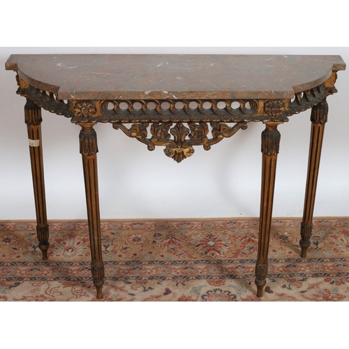 683 - A CONTINENTAL GILTWOOD CONSOLE TABLE of rectangular bowed outline surmounted by a veined marble top ... 