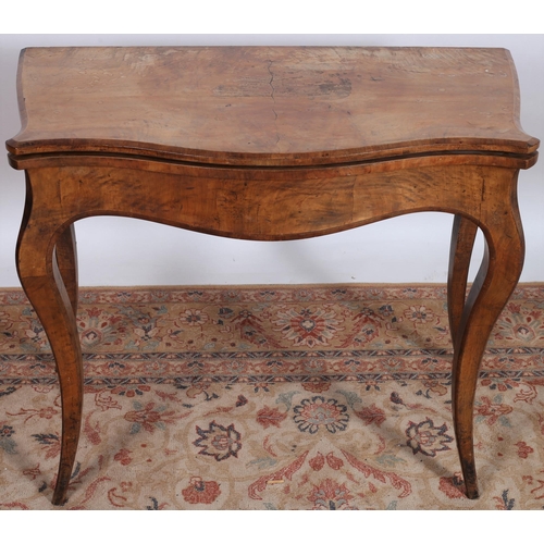 690 - A 19TH CENTURY CONTINENTAL KINGWOOD FOLDOVER CARD TABLE of serpentine outline the shaped hinged leaf... 