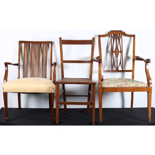 697 - A VINTAGE MAHOGANY AND UPHOLSTERED ELBOW CHAIR the shaped top rail above caned panelled splats and u... 