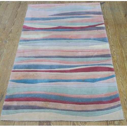 736 - A V'SOSKE JOYCE JUNGLE PATTERN MULTICOLOURED WOOL RUG 
157cm (l) x 92cm (w)