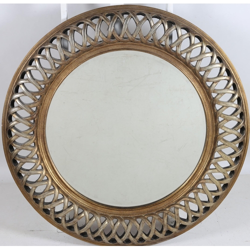 743 - A CONTINENTAL GILT FRAME MIRROR the circular bevelled glass plate within a pierced interwoven frame ... 