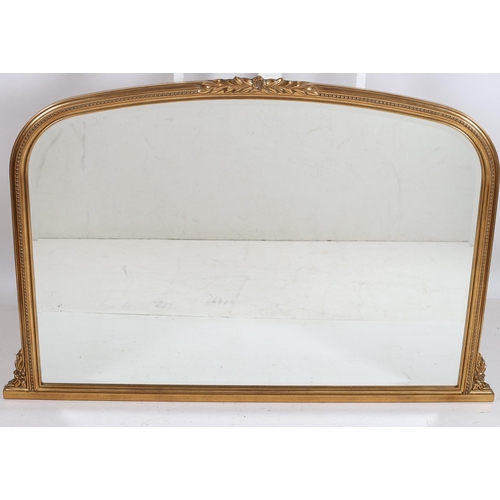 746 - A CONTINENTAL GILT FRAME MIRROR the rectangular arched bevelled glass plate within a beadwork moulde... 