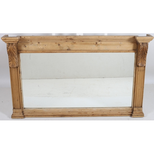 747 - A VINTAGE PINE OVERMANTLE MIRROR the rectangular plate between reeded pilasters with foliate carved ... 