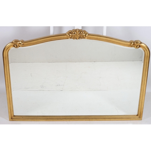 750 - A CONTINENTAL GILT FRAME OVERMANTLE MIRROR the rectangular shaped bevelled glass plate within a C-sc... 