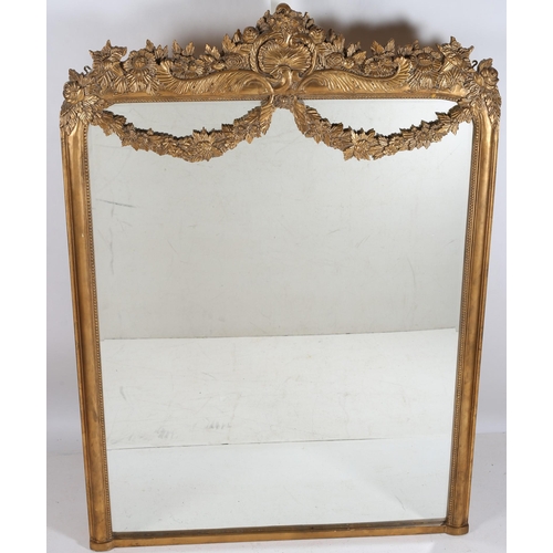 751 - A CONTINENTAL GILT FRAME MIRROR the rectangular bevelled glass plate within a moulded frame with she... 