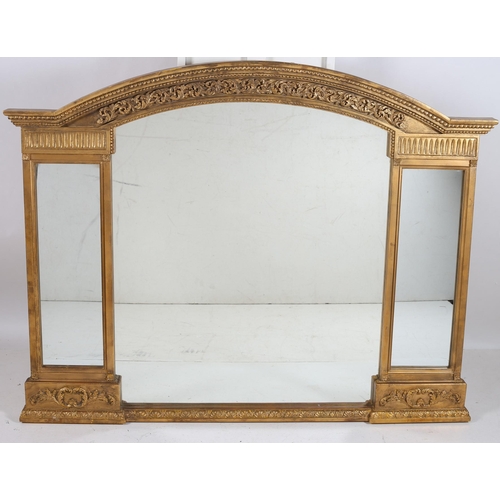 752 - A CONTINENTAL GILTWOOD AND GESSO COMPARTMENTED MIRROR of rectangular arched outline with foliate and... 