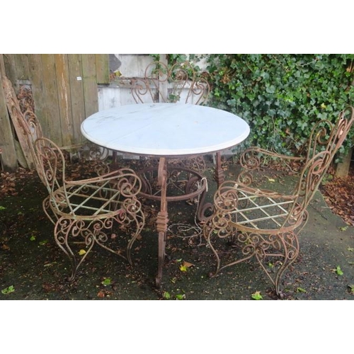 807 - A FOUR PIECE WROUGHT IRON PATIO SUITE comprising three elbow chairs each with a scroll back and arms... 