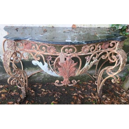 808 - A WROUGHT IRON CONSOLE TABLE of serpentine outline surmounted by a veined marble top above a C-scrol... 