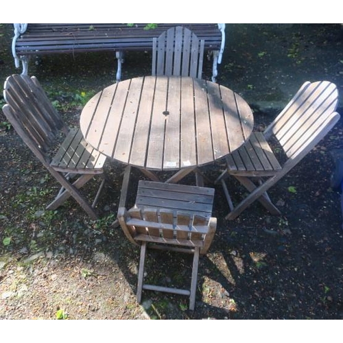 820 - A TEAK FIVE PIECE GARDEN SET comprising of four folding chairs and table