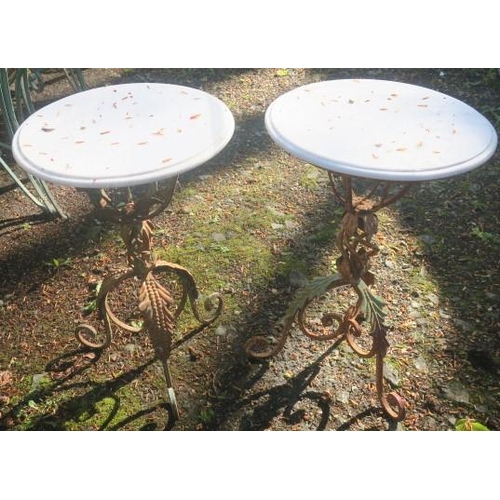 825 - A PAIR OF WROUGHT IRON PATIO TABLES each of circular outline surmounted by a white veined marble top... 