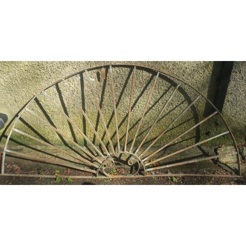 831 - A 19TH CENTURY WROUGHT IRON GRILL of demi lune outline the shaped top rail joined by square stretche... 