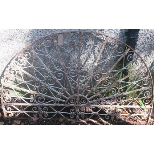 835 - A 19TH CENTURY WROUGHT IRON GRILL of demi lune outline the curved top rail joined by C-scroll and sq... 