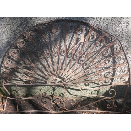 836 - A WROUGHT IRON GRILL of demi lune outline with scroll decoration 
128cm (h) x 172cm (w)