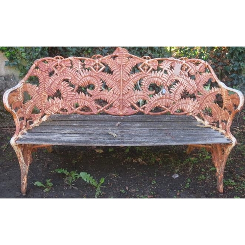 840 - A COALBROOKEDALE DESIGN CAST IRON FERN BACK  GARDEN SEAT the slatted seat on rustic legs 
91cm (h) x... 