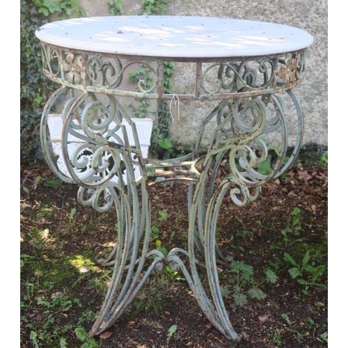 841 - A WROUGHT IRON PATIO TABLE of circular outline surmounted by a white veined marble top above a pierc... 