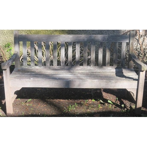 846 - THREE TEAK GARDEN BENCHES each with rectangular top rail and vertical splats with plank seat and scr... 