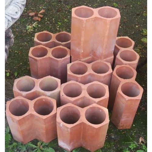 859 - TWELVE PAIRS OF TERRACOTTA WINE BOTTLE HOLDERS
26cm (h) x 24cm (w) x 13cm (d)