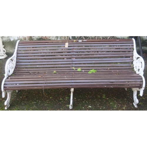 860 - A 19TH CENTURY CAST IRON AND TEAK GARDEN BENCH the shaped slatted back and seat with pierced foliate... 