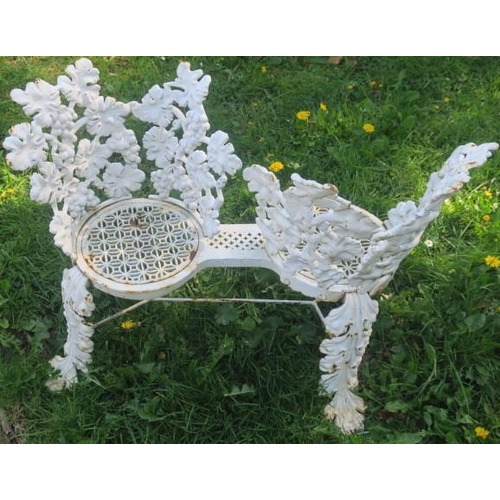 863 - A 19TH CENTURY WROUGHT IRON CONVERSATION SEAT with pierced fruiting vines above a pierced seat on fo... 