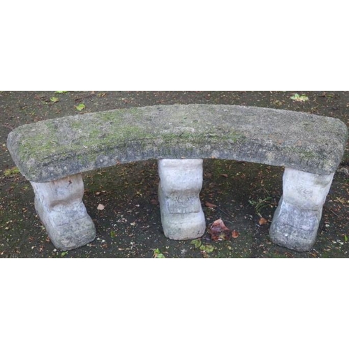 872 - A COMPOSITION SANDSTONE SEAT of demi lune outline the shaped top raised on three scroll supports the... 