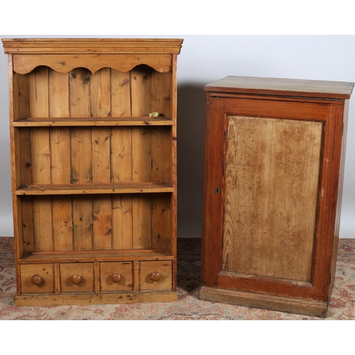 885 - A VINTAGE PINE OPEN FRONT DRESSER of rectangular outline the shaped moulded frieze above three open ... 