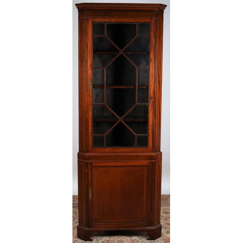 886 - A 19TH CENTURY MAHOGANY AND SATINWOOD INLAID CORNER CABINET the moulded cornice above an astragal gl... 