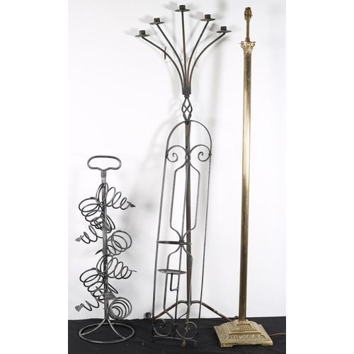 890 - A WROUGHT IRON FIVE BRANCH CANDELABRA the cylindrical and spiral twist column on tripod support toge... 