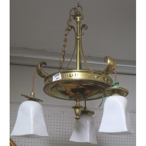 899 - A VINTAGE BRASS THREE BRANCH CHANDELIER the knopped column with scroll arms above a pierced dish sha... 