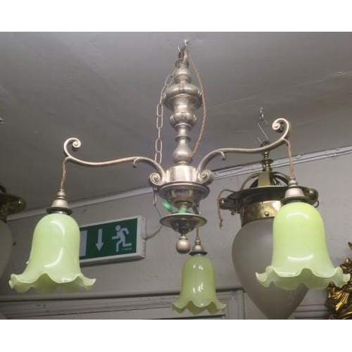 900 - A VINTAGE PLATED THREE BRANCH CHANDELIER the baluster column issuing three scroll arms with vaseline... 