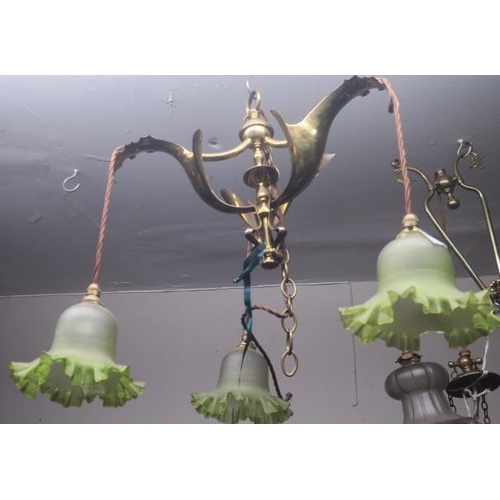 901 - AN ART NOUVEAU BRASS THREE BRANCH CHANDELIER with stylised foliate arms issuing three frosted and gr... 