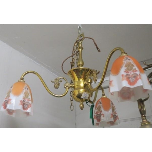 903 - A VINTAGE BRASS THREE BRANCH CHANDELIER the knopped and urn shaped column issuing three scroll arms ... 