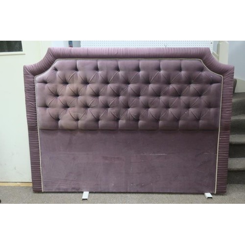 699 - A PINK AND BEIGE SILK UPHOLSTERED HEADBOARD OF RECTANGULAR ARCHED OUTLINE with buttoned upholstered ... 