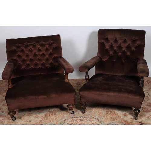 629 - TWO 19TH CENTURY MAHOGANY AND UPHOLSTERED ARMCHAIRS each with a buttoned upholstered back and seat w... 