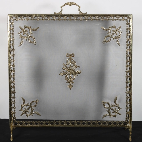 76 - A CONTINENTAL GILT BRASS AND MESH SPARK GUARD the rectangular frame with mesh screen and carrying ha... 