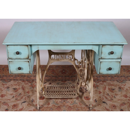 80 - A SHABBY CHIC TURQUOISE PAINTED AND WROUGHT IRON DESK of rectangular outline the shaped top above fo... 