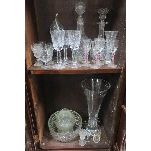 104 - A JOHN ROCHA WATERFORD CUT GLASS TRUMPET SHAPED VASE together with two cut glass decanters with stop... 