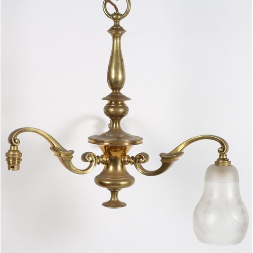 613 - A VINTAGE BRASS THREE BRANCH CHANDELIER the baluster column issuing three scroll arms with opaline g... 