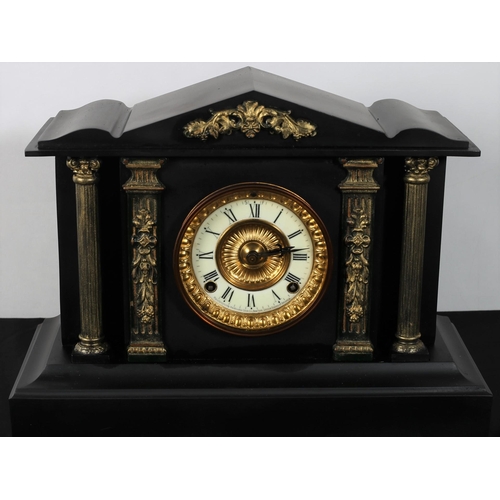 218 - A VINTAGE AMERICAN METAL CASE AND BRASS MOUNTED MANTLE CLOCK of architectural outline the circular d... 