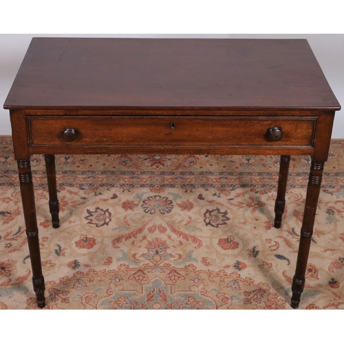 3 - A GEORGIAN MAHOGANY SIDE TABLE of rectangular outline the shaped top with frieze drawer on ring turn... 