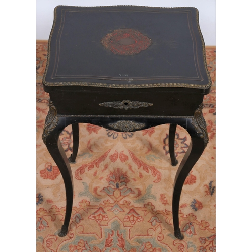 30 - A 19TH CENTURY EBONISED AND GILT BRASS MOUNTED OCCASIONAL TABLE of serpentine outline the hinged top... 