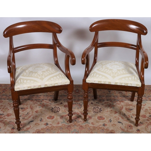 36 - A PAIR OF VICTORIAN DESIGN MAHOGANY CARVERS each with a curved top rail and splat with scroll arms a... 