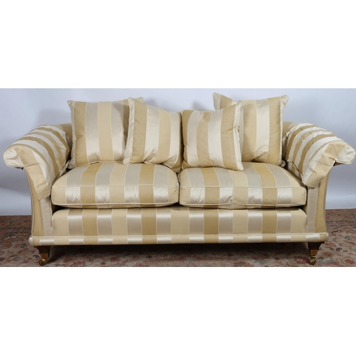 38 - A DAVID GUNDY, AMALFI DESIGN SETTEE with scroll over back and arms and loose cushions on square moul... 