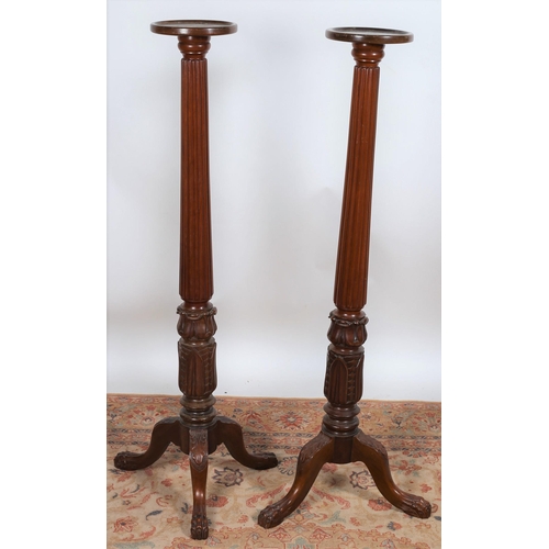 41 - A PAIR OF 19TH CENTURY CARVED MAHOGANY JARDINIERE STANDS each with a circular dish top above a reede... 